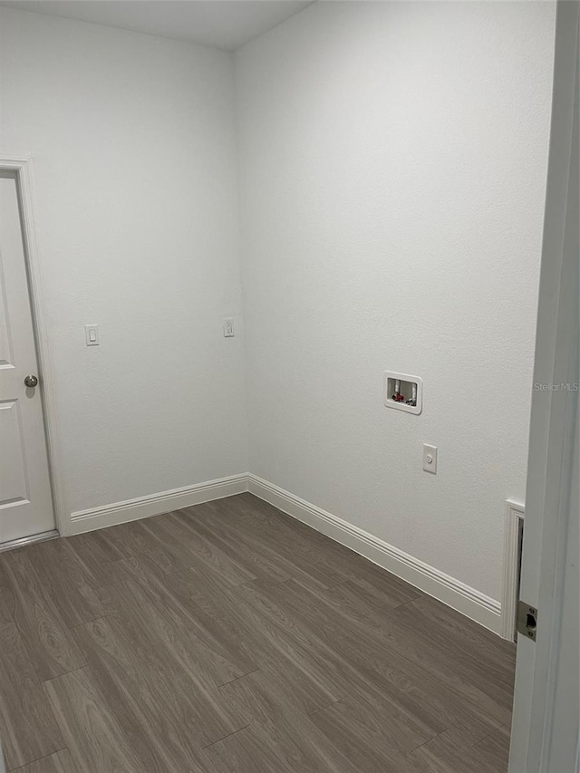 empty room featuring dark wood-type flooring