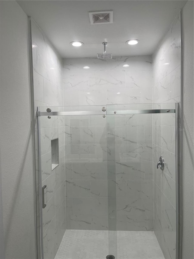 bathroom featuring an enclosed shower