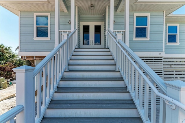 view of exterior entry featuring french doors