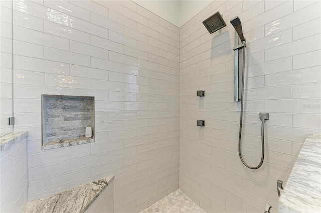 bathroom featuring tiled shower