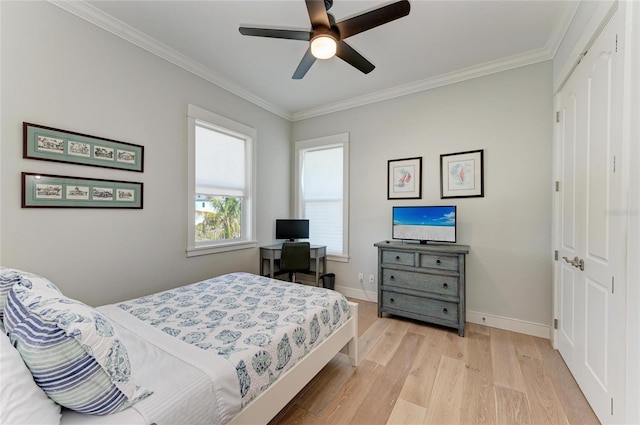 bedroom featuring ornamental molding, light hardwood / wood-style floors, and a closet