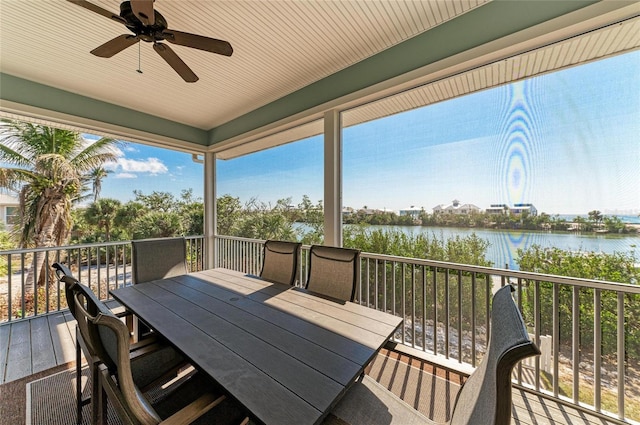exterior space with a water view and ceiling fan