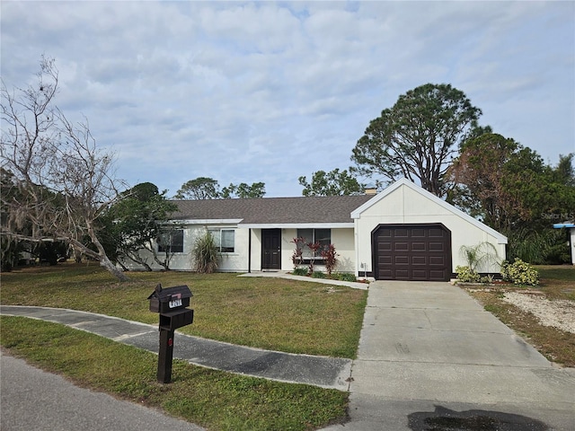 single story home featuring a garage and a front yard