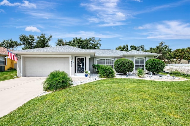 single story home featuring cooling unit, a garage, and a front lawn