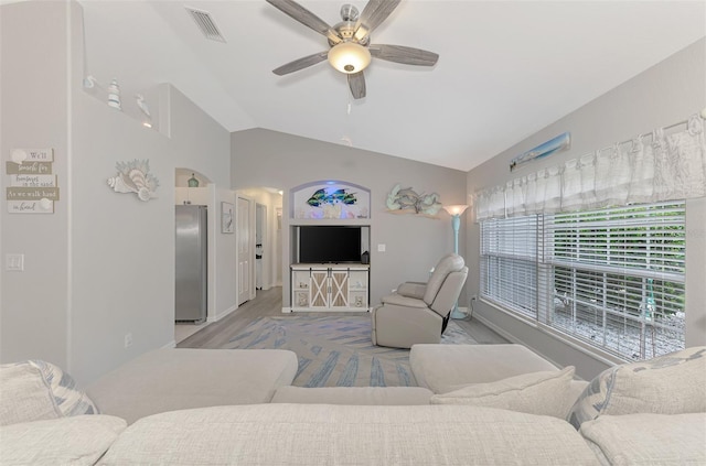 living room with vaulted ceiling, ceiling fan, and light hardwood / wood-style floors