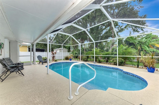 view of pool with a lanai and a patio