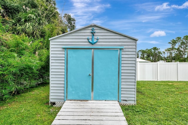 view of outdoor structure with a yard