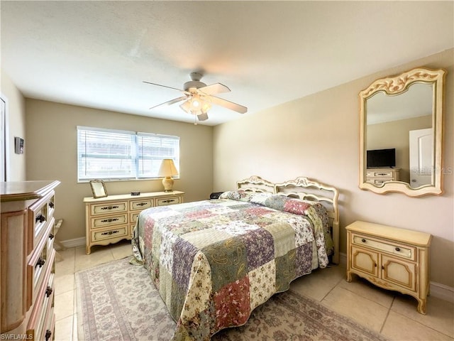 bedroom with ceiling fan and light tile patterned flooring