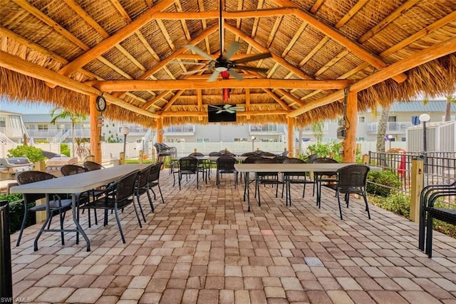 view of patio / terrace featuring a gazebo and ceiling fan