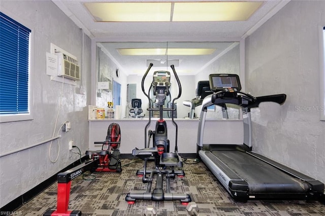 exercise area with a wall mounted air conditioner