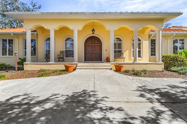 property entrance with covered porch