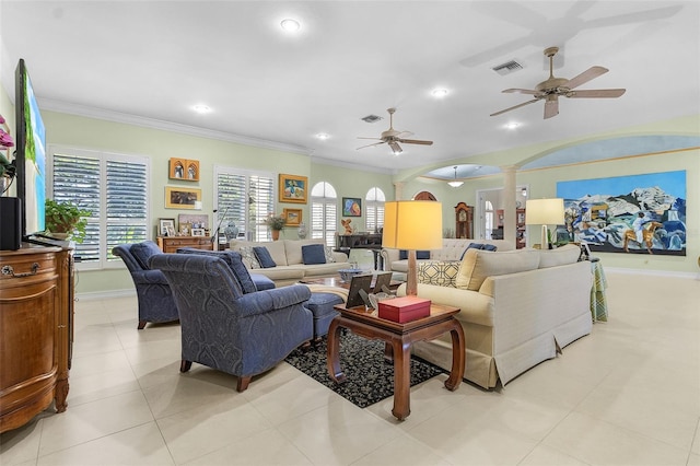 living room with ornamental molding, decorative columns, ceiling fan, and light tile patterned flooring