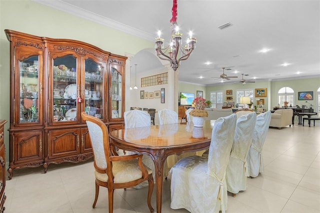 dining room featuring ornamental molding, ceiling fan with notable chandelier, and light tile patterned floors