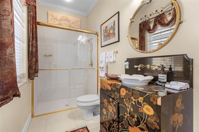 bathroom with toilet, a shower with shower door, ornamental molding, plenty of natural light, and tile patterned flooring