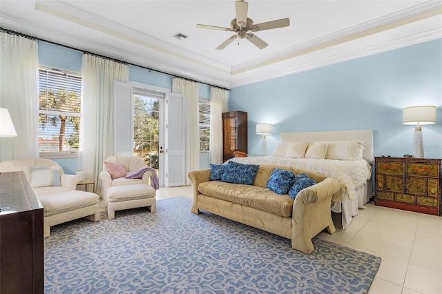 bedroom featuring light tile patterned floors, ceiling fan, a tray ceiling, ornamental molding, and access to outside