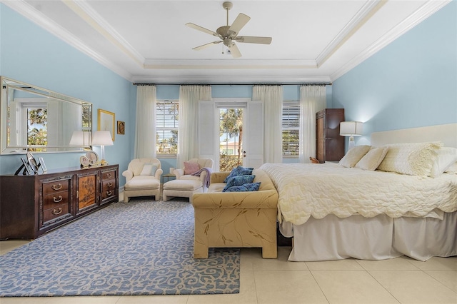 tiled bedroom featuring crown molding, access to exterior, and a tray ceiling