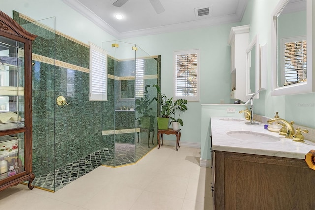 bathroom with ornamental molding, vanity, ceiling fan, and a shower with shower door