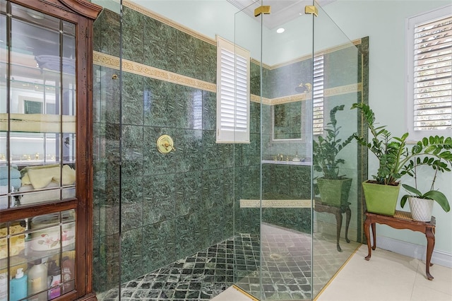 bathroom with tile patterned floors and an enclosed shower