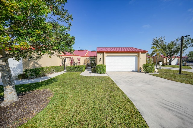 view of front of property with a garage and a front lawn