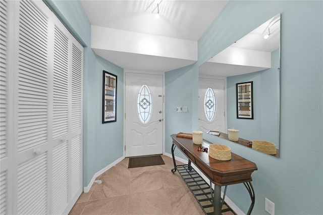 foyer featuring light tile patterned flooring