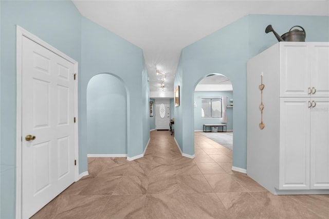 hall with light tile patterned flooring