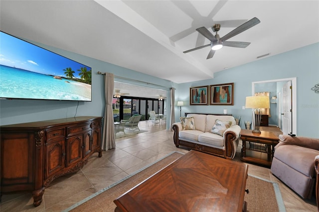 tiled living room featuring vaulted ceiling and ceiling fan