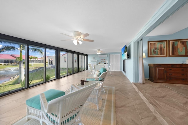 sunroom / solarium with ceiling fan