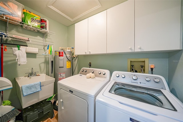 washroom with cabinets, independent washer and dryer, electric water heater, and sink