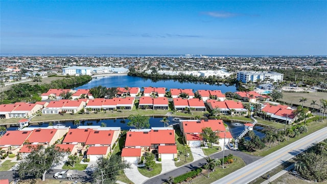 birds eye view of property with a water view