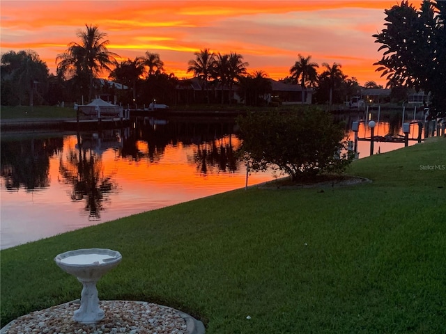 yard at dusk with a water view