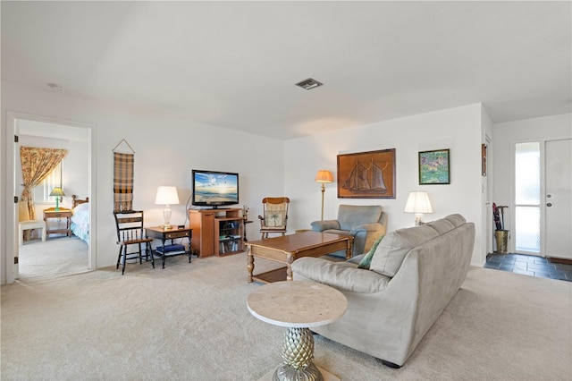 living room featuring light carpet