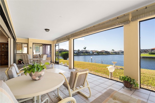 sunroom with a water view