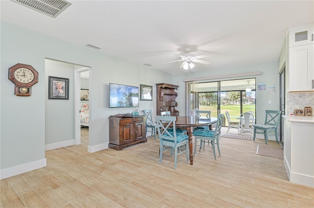 dining space featuring ceiling fan and light hardwood / wood-style floors