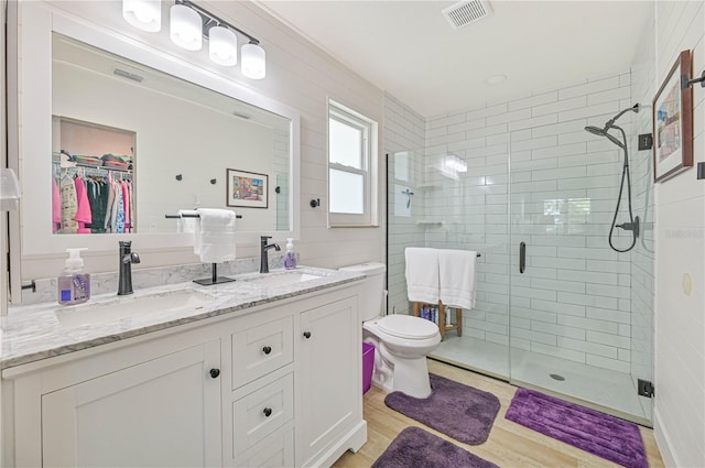 bathroom with vanity, an enclosed shower, and toilet