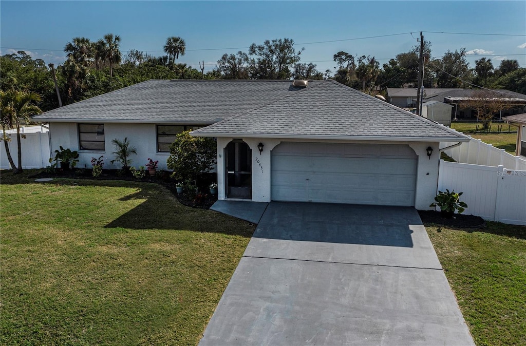 single story home with a garage and a front yard