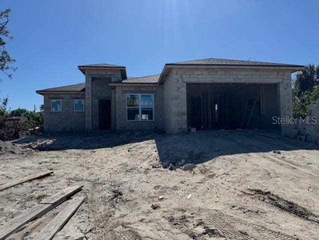 property in mid-construction featuring a garage