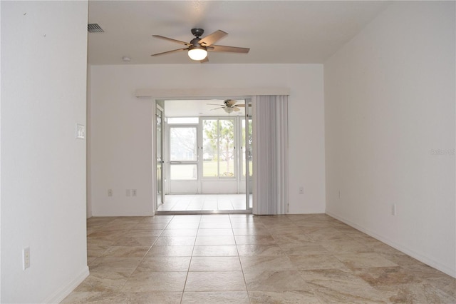 unfurnished room featuring ceiling fan