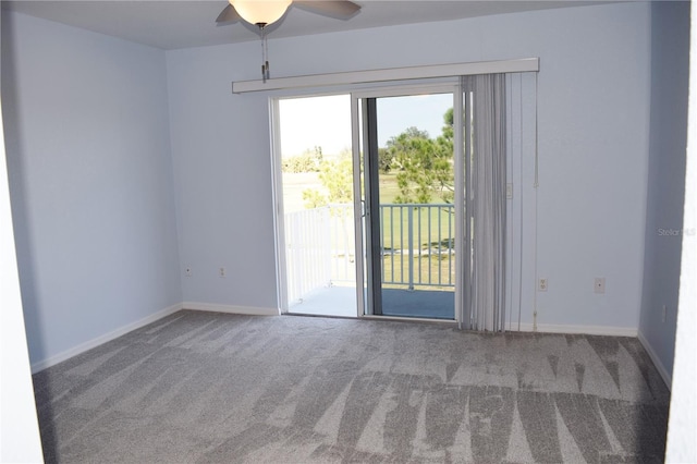 spare room featuring ceiling fan and carpet floors