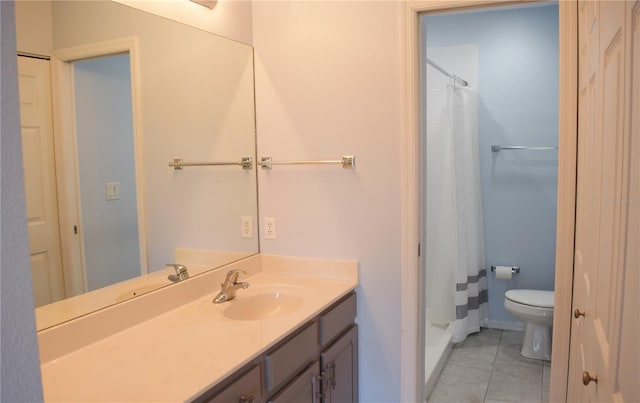 bathroom featuring tile patterned flooring, vanity, a shower with shower curtain, and toilet