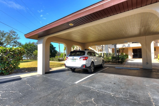 view of car parking featuring a carport