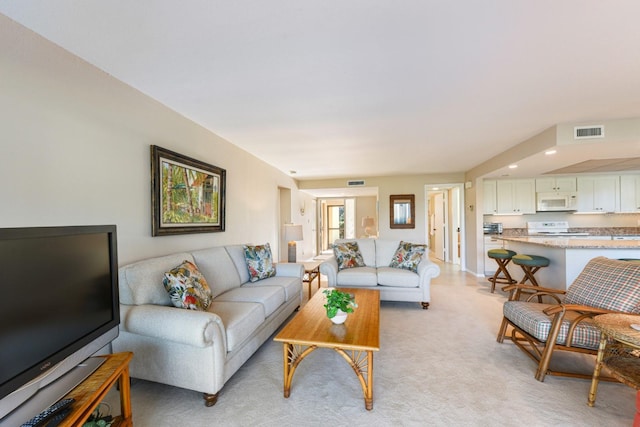 living room with light colored carpet