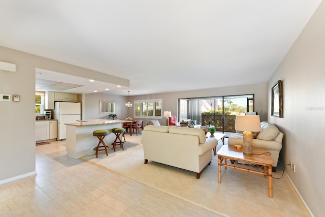 living room featuring a notable chandelier