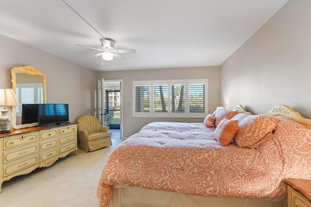 bedroom featuring light colored carpet and ceiling fan