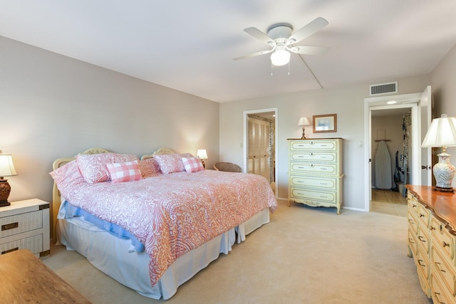 bedroom featuring light colored carpet and ceiling fan