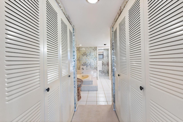 corridor featuring light tile patterned floors