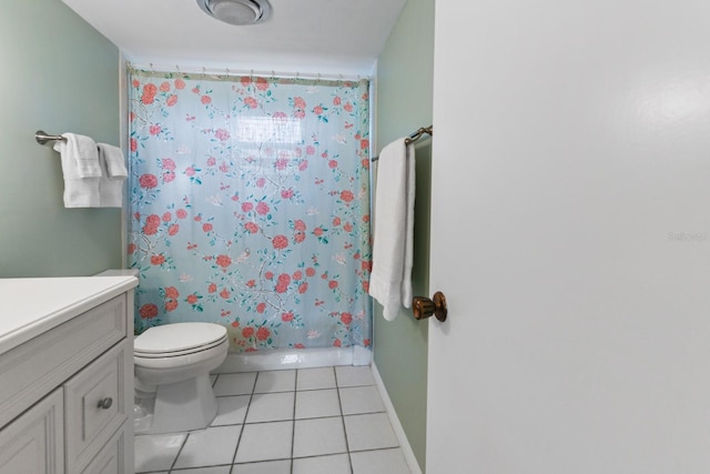 full bathroom featuring vanity, shower / tub combo with curtain, tile patterned floors, and toilet