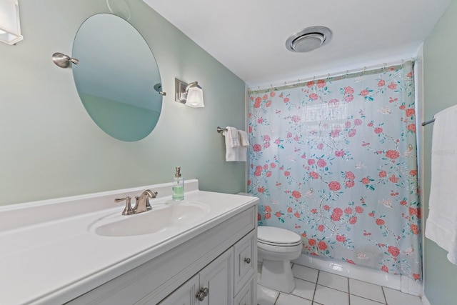 bathroom featuring walk in shower, tile patterned floors, toilet, and vanity