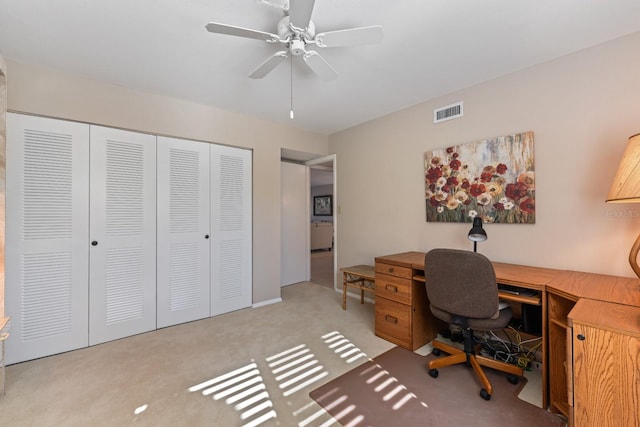 home office with light colored carpet and ceiling fan