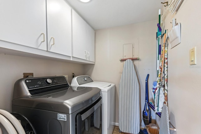 laundry room with cabinets and washing machine and dryer