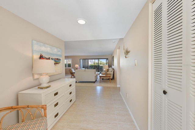 hall with light tile patterned flooring